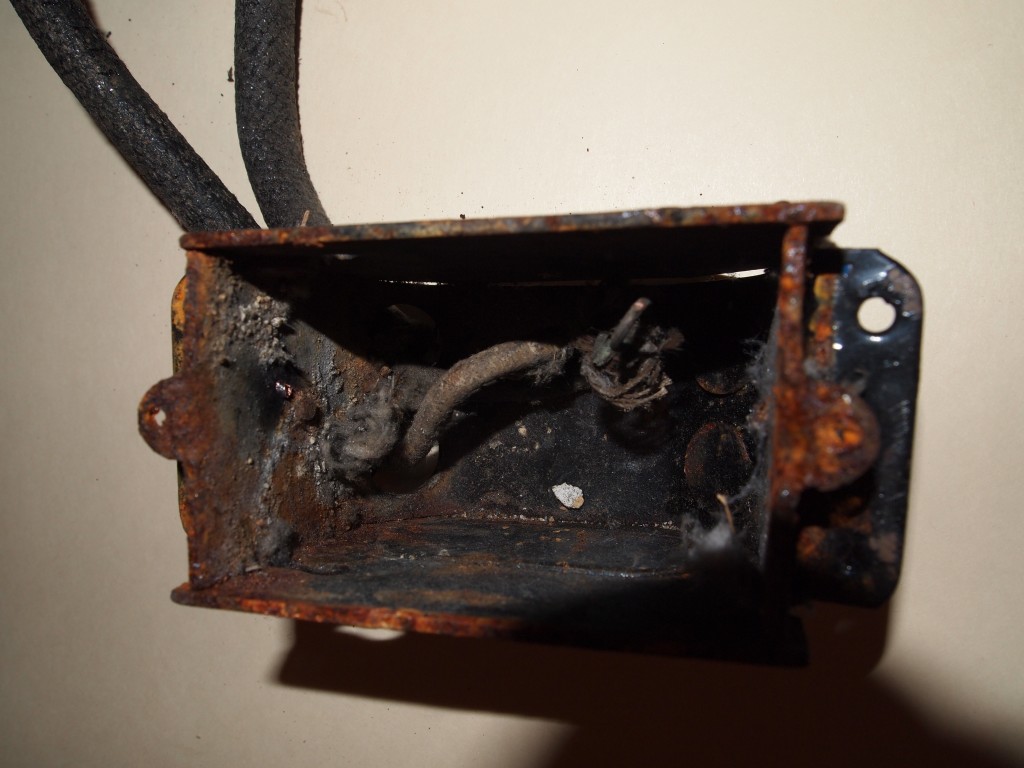 Old electrical box buried beneath the plaster in Bedroom 3