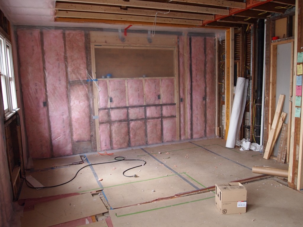 New kitchen space is insulated and plastic stapled in place