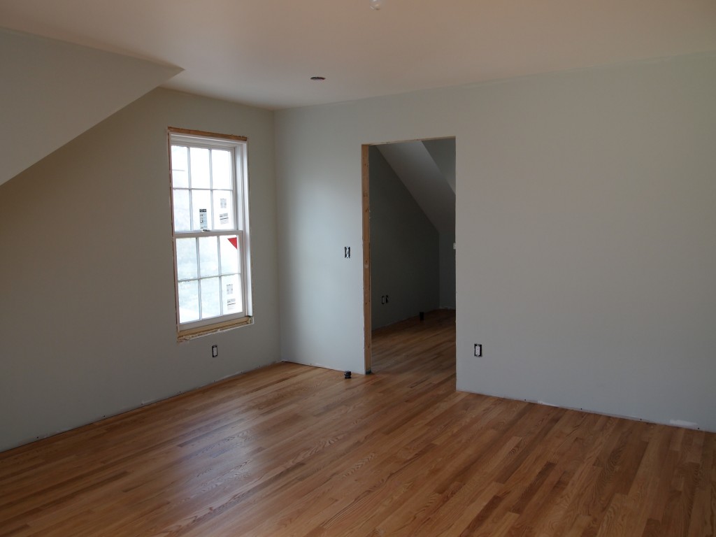 The finished oak floor in the bedroom.